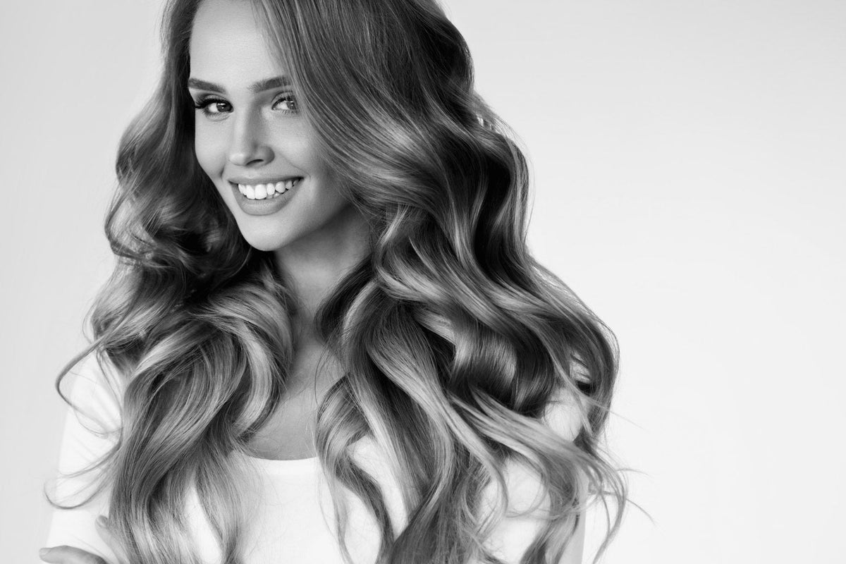 Woman with long, glossy waves — Margaret Josefin Intensive Hair Care Essence guide, Kija Hair Salon
